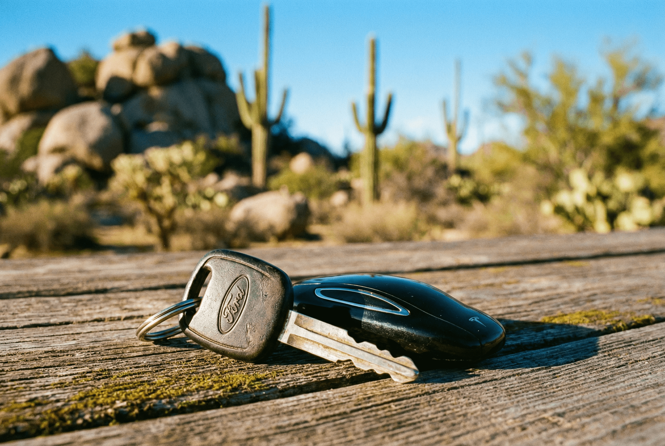 Transponder car key and smart fob with Cave Creek Arizona desert background for key programming service